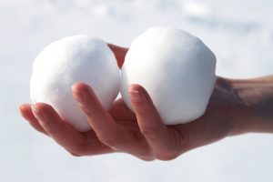 Two balls of packed snow, which could be packed into a bong to make your weed taste better.